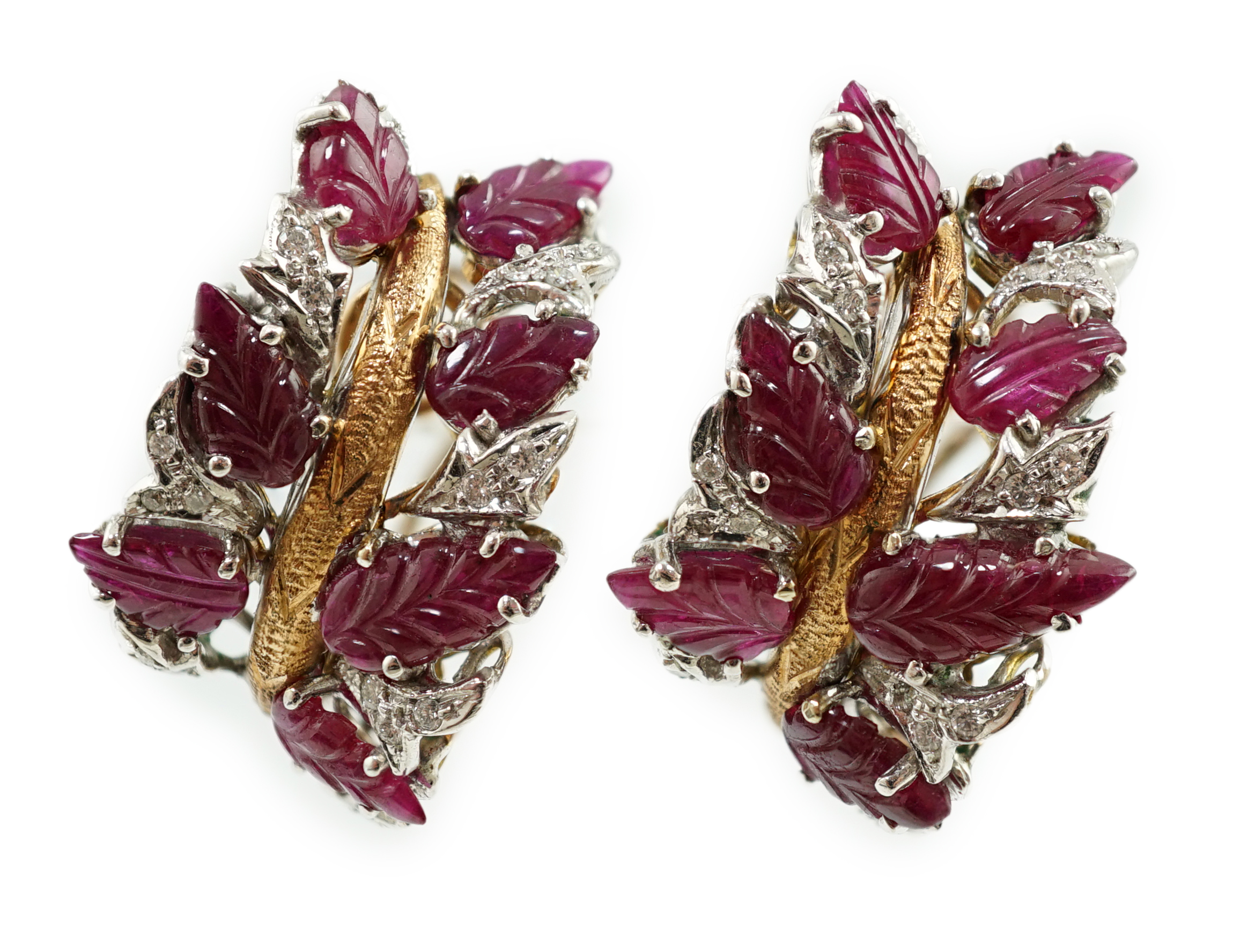 A modern pair of 18k, ruby and diamond cluster set demi-lune earrings